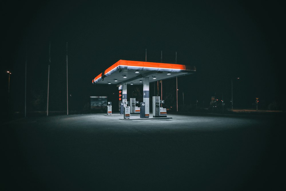 Fuel station forecourt lit up at night
